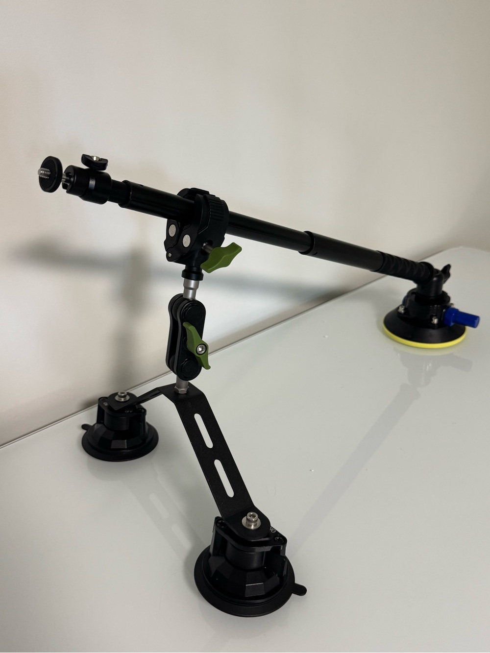 Adjustable Black Camera Mounting Arm with Green Accents